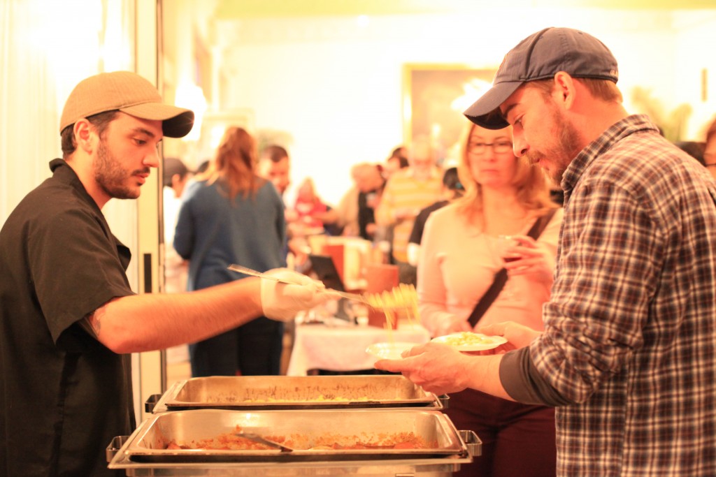 Diners line up for brisket and mac and cheese prepared by Prospect Bar & Grill.